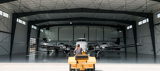 planes sitting inside of hangar
