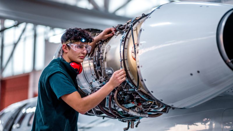 technician working on plane engine